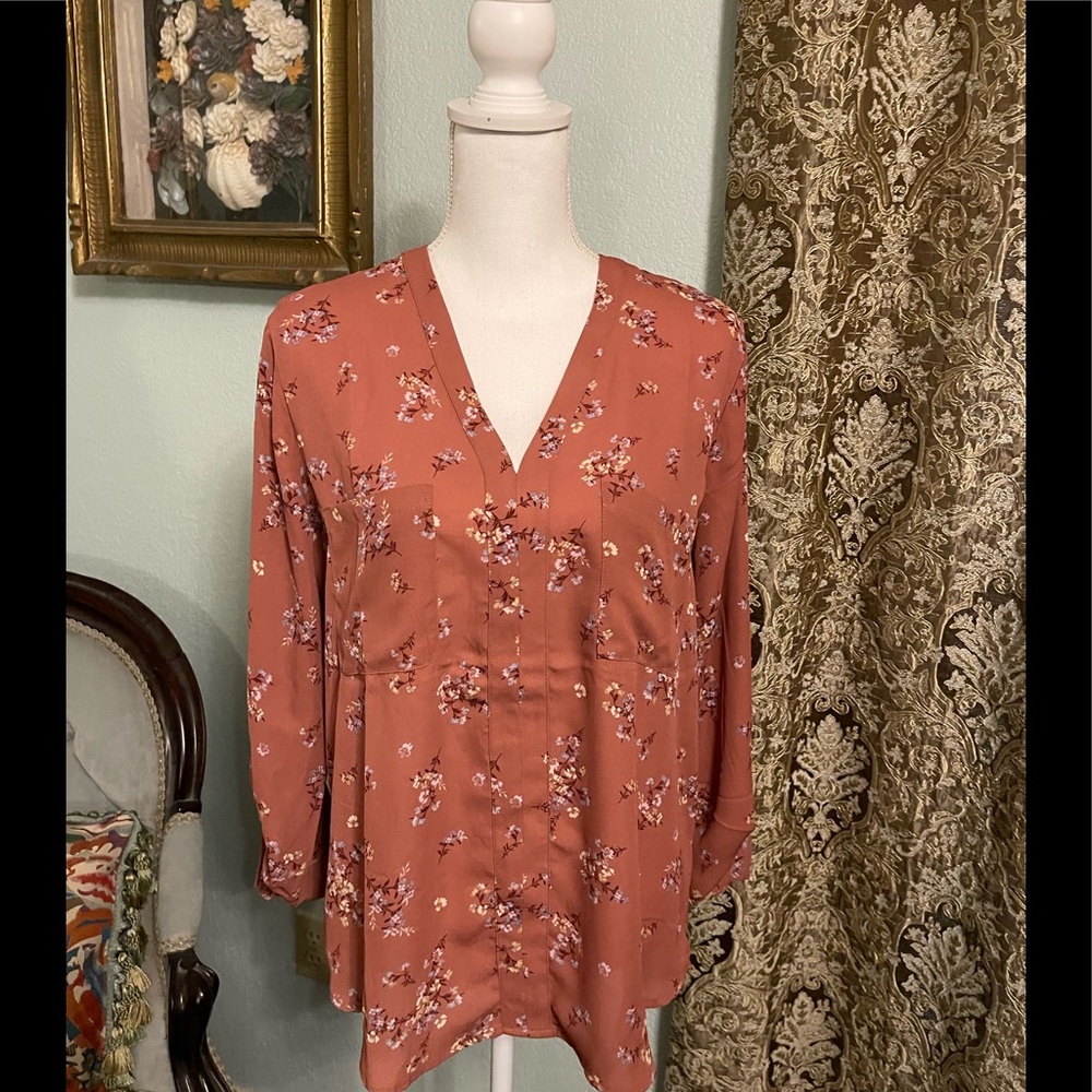 Dark pink 3/4 sleeve pullover blouse.